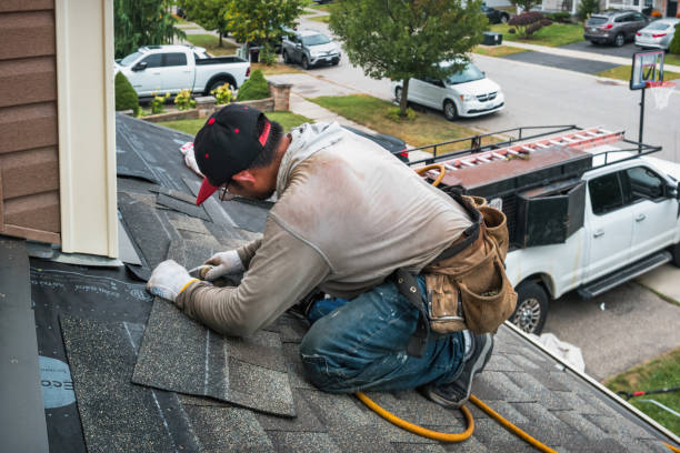 Professional Gutter Repair And Installation technician working in Wainscott, NY
